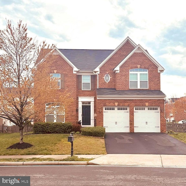view of front facade featuring a garage, driveway, and brick siding