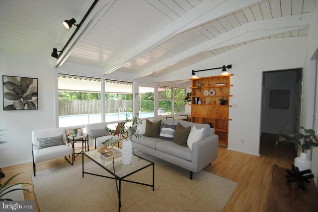 7807 Sycamore Dr, Falls Church, VA 22042 - living area with light wood-style floors, baseboards, and wood ceiling