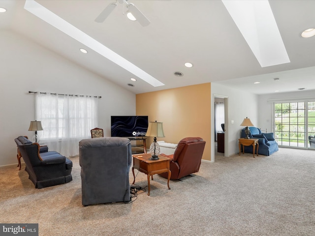 living room featuring a skylight, carpet, vaulted ceiling, recessed lighting, and ceiling fan