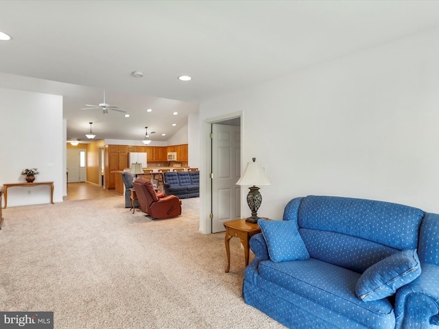 living area featuring light colored carpet, recessed lighting, a ceiling fan, and lofted ceiling