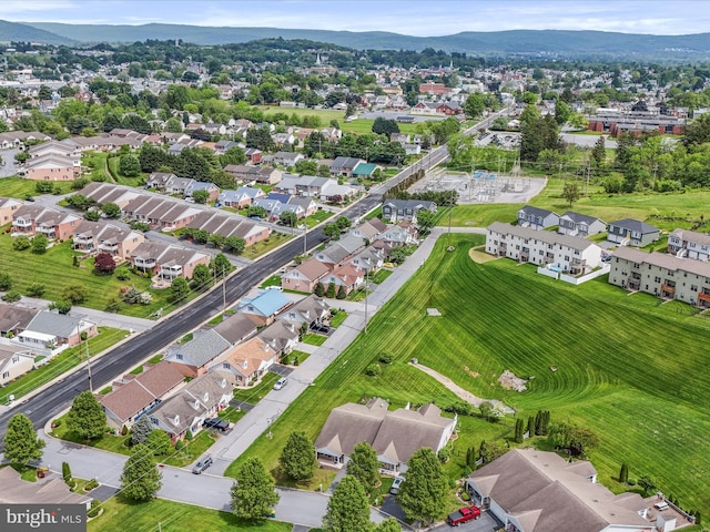 view of property location featuring a mountainous background and nearby suburban area