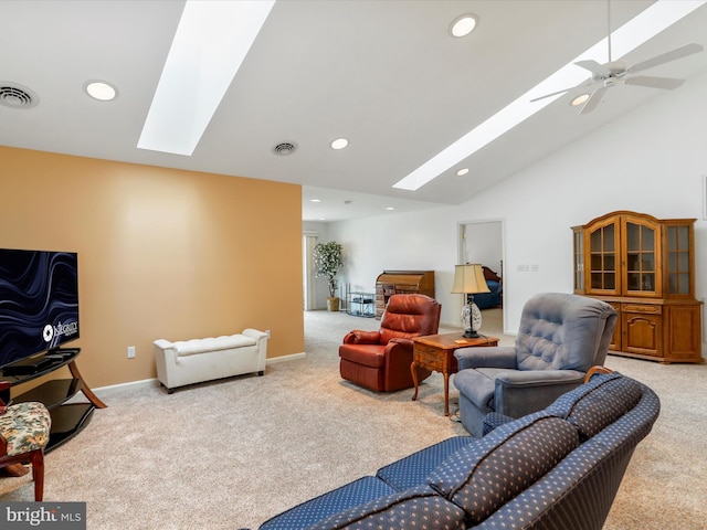 living area featuring a skylight, carpet flooring, recessed lighting, baseboards, and high vaulted ceiling