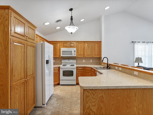 kitchen with white appliances, a sink, lofted ceiling, a peninsula, and backsplash