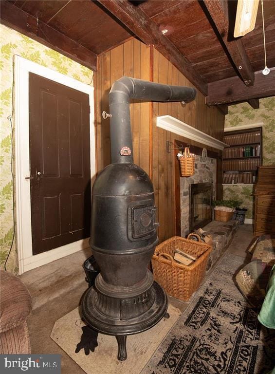 1025 Reihman Rd, Green Lane, PA 18054 - detailed view of wood ceiling with exposed beams, wooden walls, a fireplace, and carpet floors