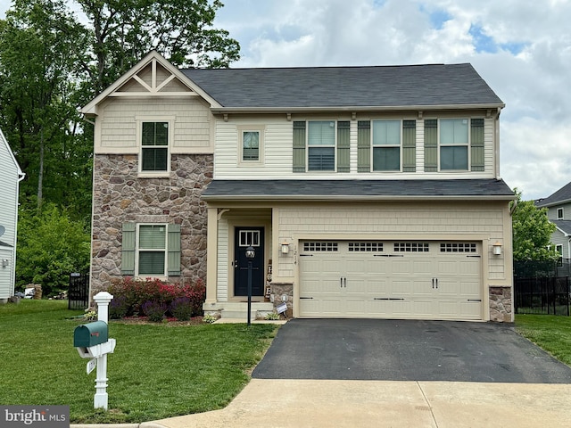craftsman-style home featuring stone siding, an attached garage, asphalt driveway, a front yard, and roof with shingles