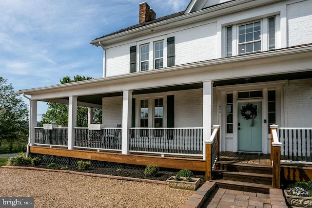 644 Early Dr, Broadway, VA 22815 - entrance to property featuring brick siding, covered porch, and a chimney