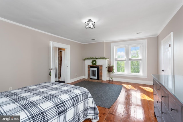 644 Early Dr, Broadway, VA 22815 - bedroom featuring wood-type flooring, crown molding, a brick fireplace, and baseboards
