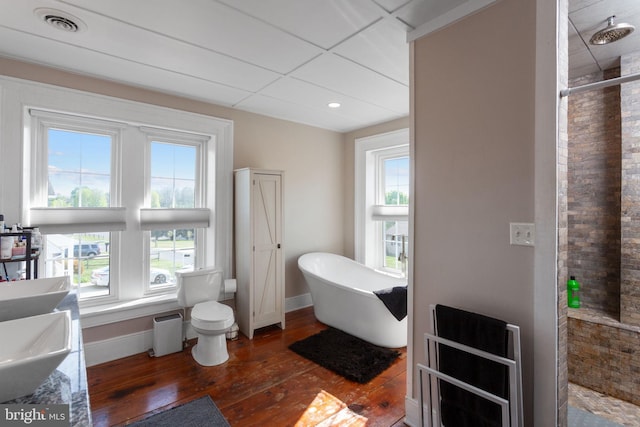 644 Early Dr, Broadway, VA 22815 - full bath with hardwood / wood-style floors, a soaking tub, tiled shower, baseboards, and toilet