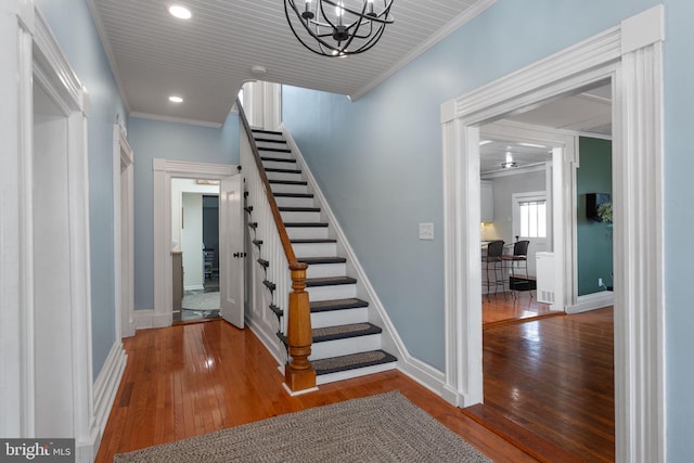644 Early Dr, Broadway, VA 22815 - staircase with hardwood / wood-style flooring, baseboards, a chandelier, crown molding, and recessed lighting