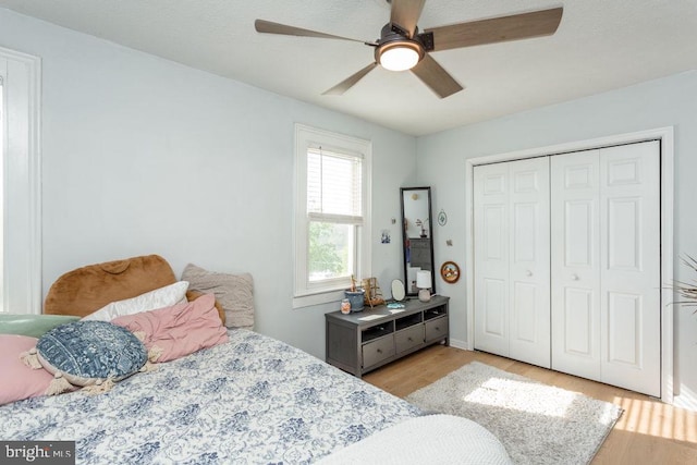 644 Early Dr, Broadway, VA 22815 - bedroom with light wood-type flooring, a closet, ceiling fan, and baseboards