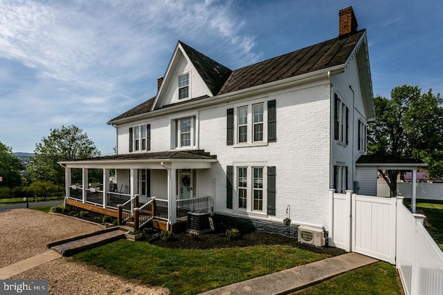 644 Early Dr, Broadway, VA 22815 - view of front of home featuring covered porch, a chimney, a cooling unit, central air condition unit, and brick siding