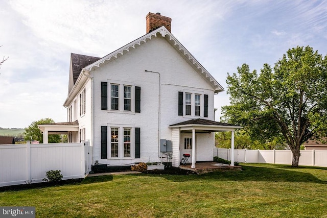 644 Early Dr, Broadway, VA 22815 - back of house featuring a chimney, brick siding, and a patio area