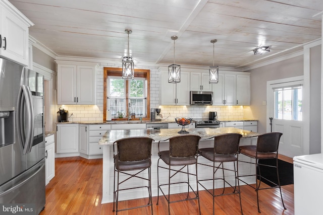 644 Early Dr, Broadway, VA 22815 - kitchen featuring appliances with stainless steel finishes, plenty of natural light, light wood-style floors, wood ceiling, and crown molding
