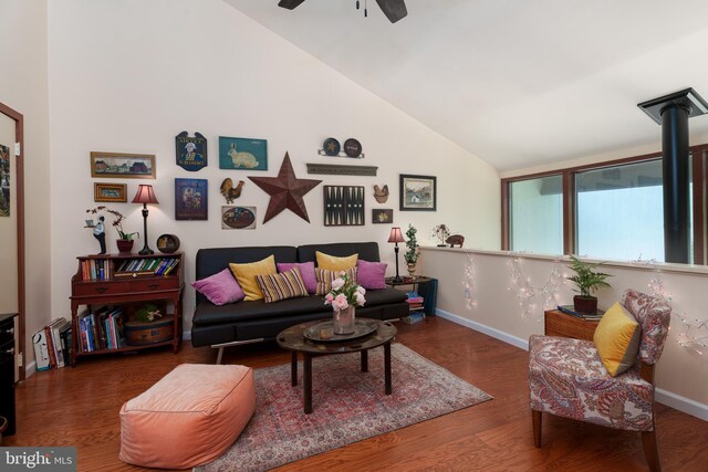 living room with a ceiling fan, wood finished floors, high vaulted ceiling, and baseboards