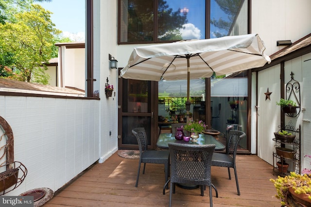 deck featuring outdoor dining area