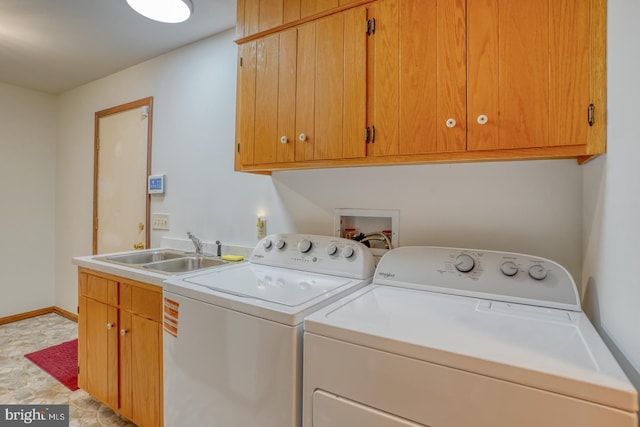 laundry room featuring cabinet space, separate washer and dryer, and baseboards