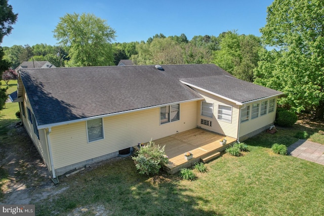 back of house with a wooden deck, a yard, a shingled roof, and cooling unit
