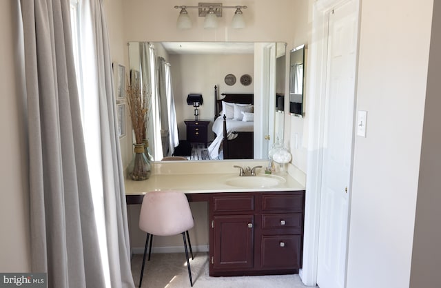 ensuite bathroom featuring vanity