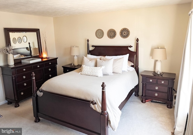 bedroom featuring light colored carpet