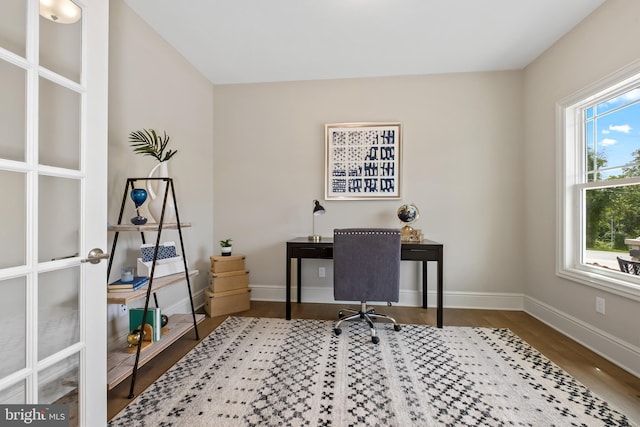 office featuring wood finished floors and baseboards