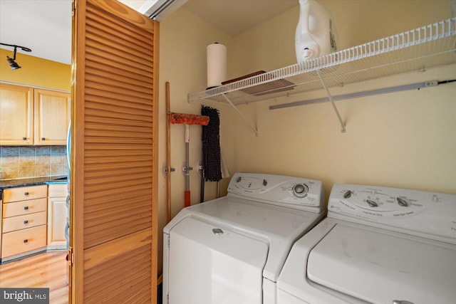 1805 Crystal Dr Unit 1011S, Arlington, VA 22202 - washroom featuring washer and dryer and light wood-style floors