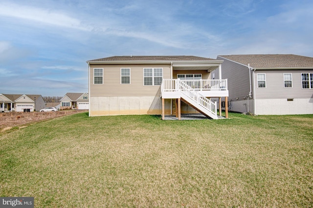 1143 Kayla Ln, Townsend, DE 19734 - back of house featuring stairway, a lawn, and a deck