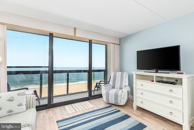10900 Coastal Hwy Unit 805, Ocean City, MD 21842 - bedroom featuring a textured ceiling and light wood-type flooring