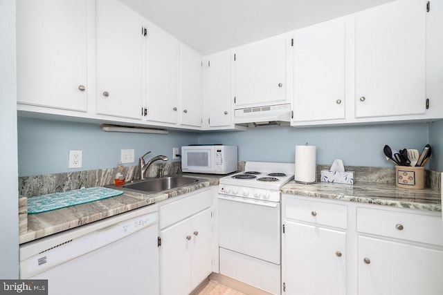 10900 Coastal Hwy Unit 805, Ocean City, MD 21842 - kitchen with under cabinet range hood, white appliances, a sink, light countertops, and white cabinets