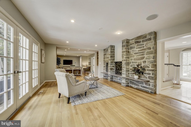 10013 Ormond Rd, Potomac, MD 20854 - living room featuring a fireplace, wood finished floors, baseboards, and recessed lighting