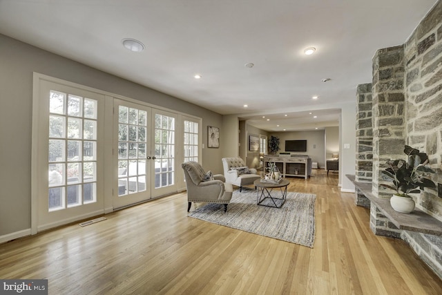 10013 Ormond Rd, Potomac, MD 20854 - living room featuring wood finished floors, french doors, baseboards, and recessed lighting