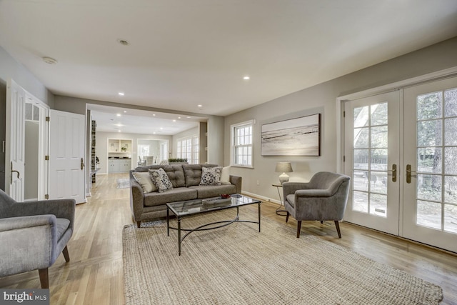 10013 Ormond Rd, Potomac, MD 20854 - living room featuring french doors, light wood finished floors, recessed lighting, and baseboards