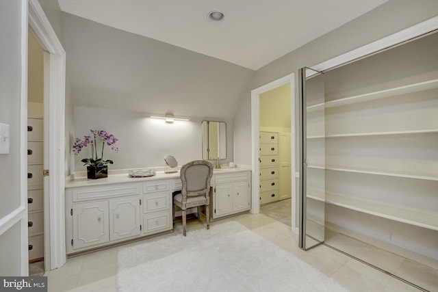 10013 Ormond Rd, Potomac, MD 20854 - office with built in desk, a sink, light tile patterned floors, and vaulted ceiling