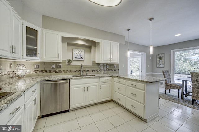 10013 Ormond Rd, Potomac, MD 20854 - kitchen with dishwasher, a sink, a peninsula, decorative backsplash, and white cabinets