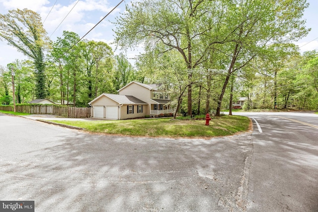 11874 Highview Cir, Lusby, MD 20657 - view of front of house with an attached garage and driveway