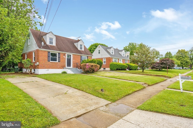 3531 Milford Mill Rd, Baltimore, MD 21244 - cape cod-style house with brick siding, a front lawn, and concrete driveway