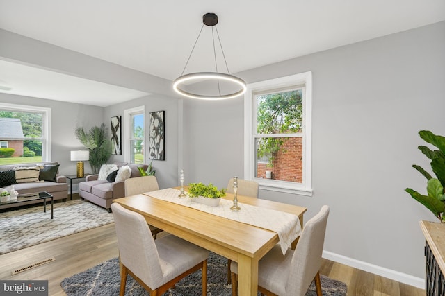 3531 Milford Mill Rd, Baltimore, MD 21244 - dining room with wood finished floors, plenty of natural light, and baseboards