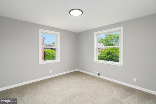 3531 Milford Mill Rd, Baltimore, MD 21244 - spare room with baseboards, healthy amount of natural light, and carpet