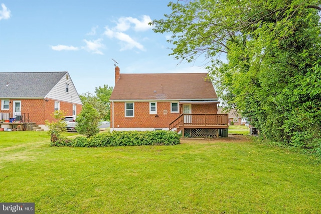 3531 Milford Mill Rd, Baltimore, MD 21244 - rear view of property with a chimney, a yard, a wooden deck, and brick siding
