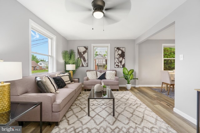 3531 Milford Mill Rd, Baltimore, MD 21244 - living area featuring wood finished floors, baseboards, and ceiling fan