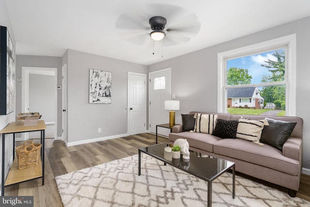 3531 Milford Mill Rd, Baltimore, MD 21244 - living room with wood finished floors, ceiling fan, and baseboards