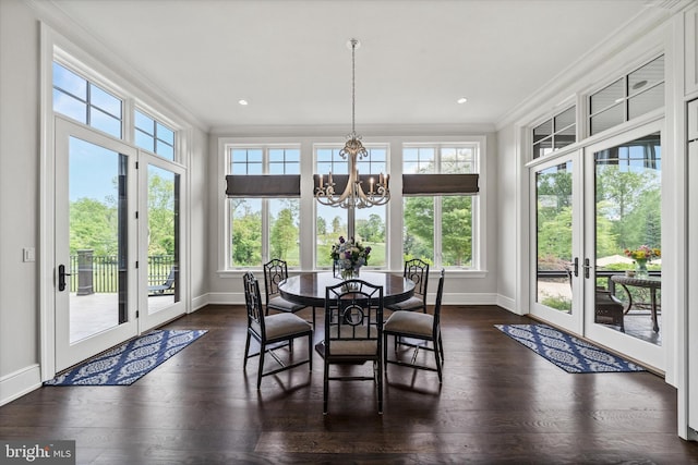 101 Greenspring Rd, Wilmington, DE 19807 - dining room with ornamental molding, french doors, a chandelier, plenty of natural light, and dark wood-style floors