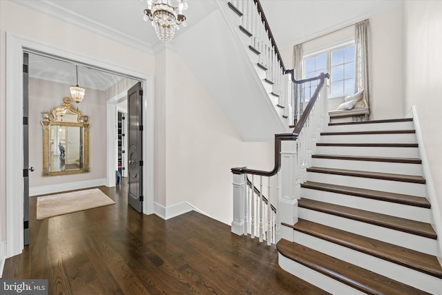 101 Greenspring Rd, Wilmington, DE 19807 - entrance foyer featuring a chandelier, stairway, dark wood-style floors, and crown molding