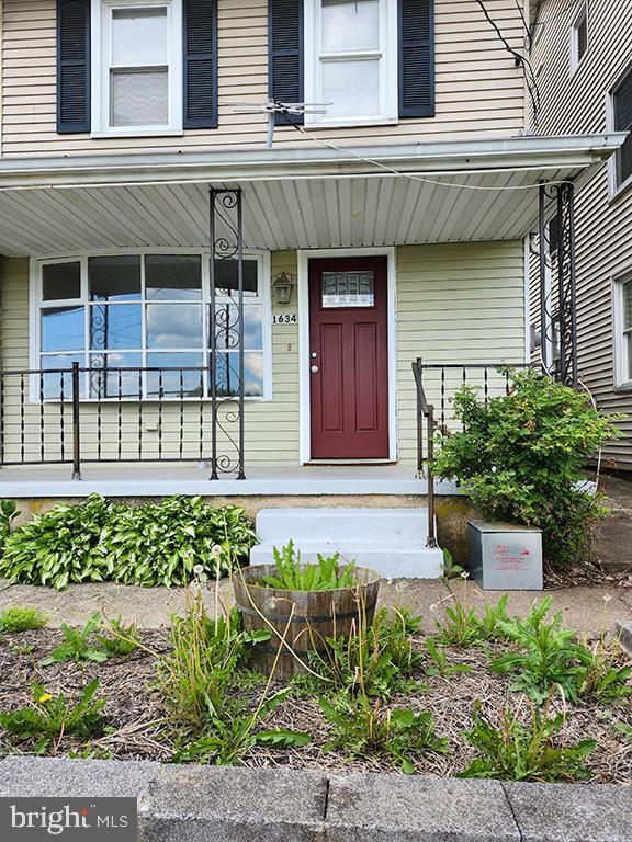 entrance to property with a porch