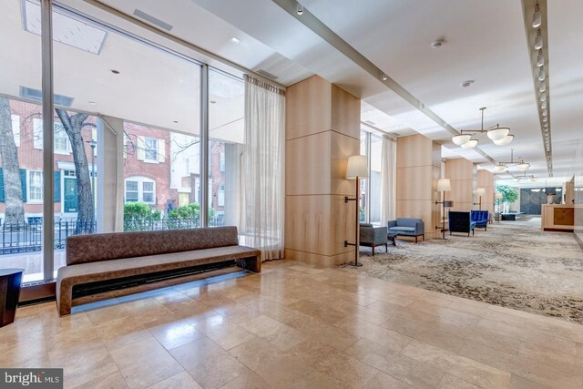 224-30 W Rittenhouse Unit 1108, Philadelphia, PA 19103 - building lobby with a high ceiling and floor to ceiling windows