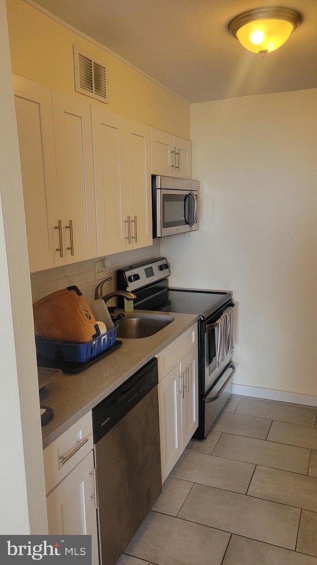 224-30 W Rittenhouse Unit 1108, Philadelphia, PA 19103 - kitchen with appliances with stainless steel finishes, a sink, white cabinetry, and light countertops