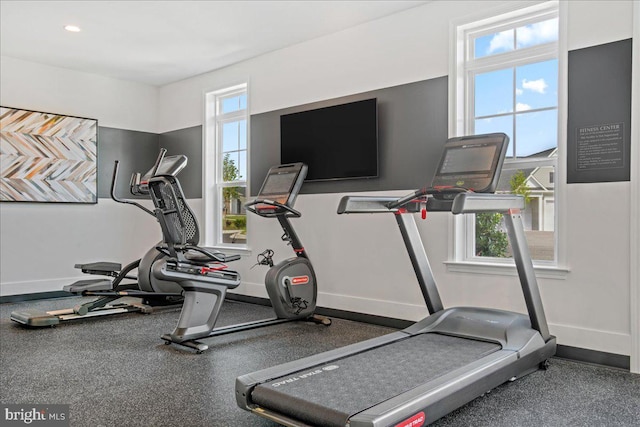 workout room with baseboards and recessed lighting
