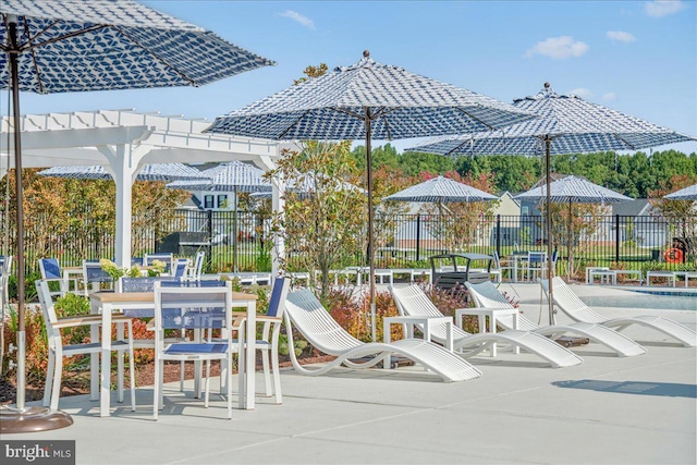 view of patio featuring fence and a pergola