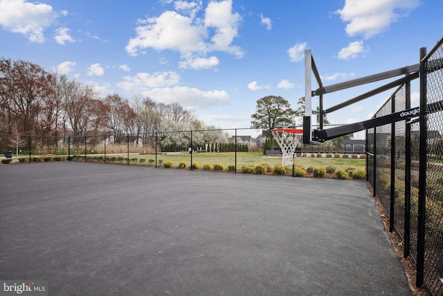 view of sport court featuring community basketball court and fence