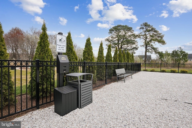 view of property's community with fence