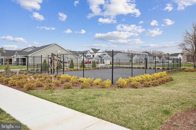 view of community with a residential view and community basketball court